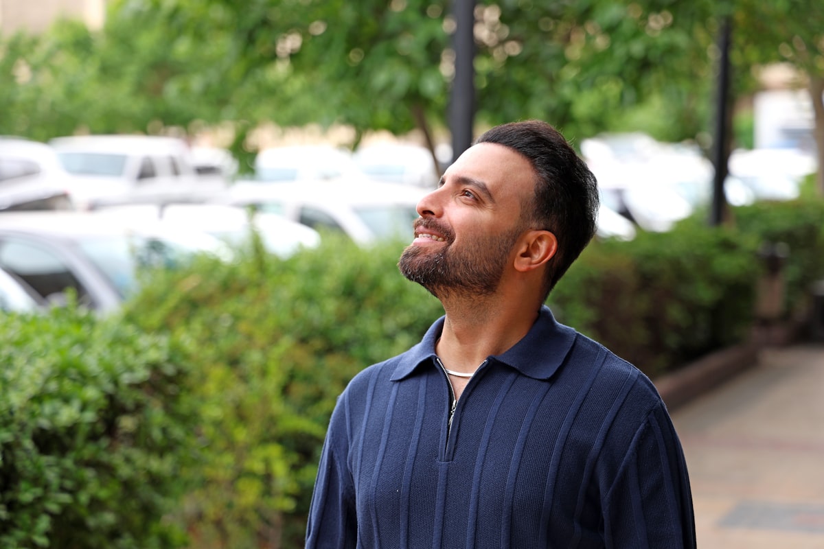 Man meditating in nature with calm expression